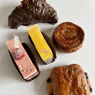 (top to bottom, left to right) Chocolate Covered Croissant, Red Velvet, Yuzu Passion, Kouign Amann, New Choco Croissant