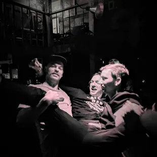 A few friends of a bachelor party hoisting up their best mate during Nicky Diamond&apos;s Karaoke Night