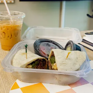 a sandwich and a drink on a table