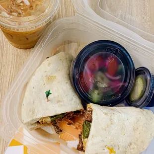 a sandwich and a drink on a table