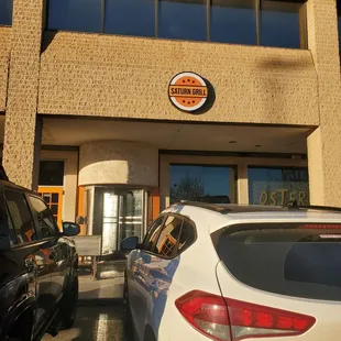 cars parked in front of a restaurant