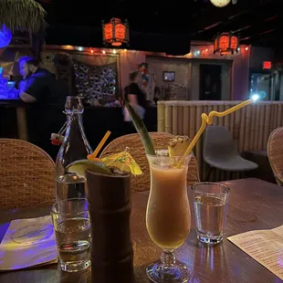 two cocktails on a table