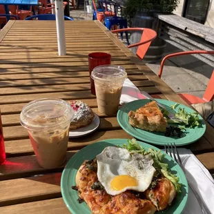 Iced lattes with vanilla cinnamon syrup; focaccia with Sunnyside up egg; daily quiche; and raspberry/pistachio/chocolate croissant.