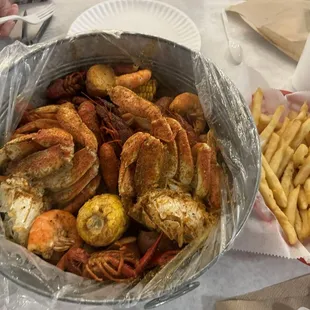 Spicy boil bag with 1 lb. Crawfish, 1 lb. Shrimp, 1 lb. Dungeness Crab Legs. Plus fries