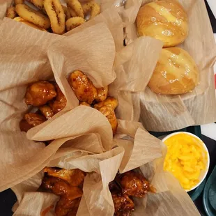 Fried Calamari, 10 PCS mix &amp; Match Wings Combo (Mild- Korean) , 10 PCS Boneless Wings Combo (sweet chili - Mango), Mac n Cheese and rolls.