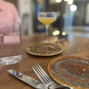 a plate of food and a glass of water