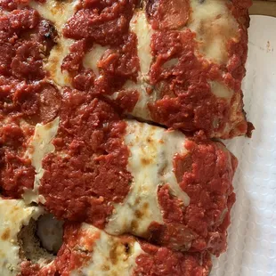 a slice of pizza in a box