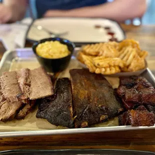 3 meat combo (brisket, pork ribs, pork belly burnt ends) with 2 sides (Mac n cheese, seasoned waffle fries)