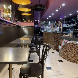 a restaurant with tables and chairs