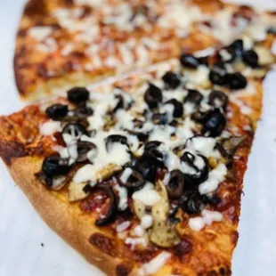 Cheese Pizza slice with Black Olives and Mushrooms slice to go