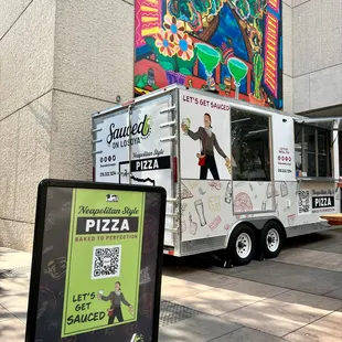 a food truck parked in front of a building