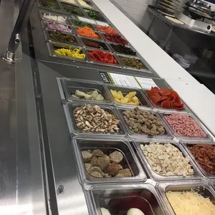 a variety of food in a display case