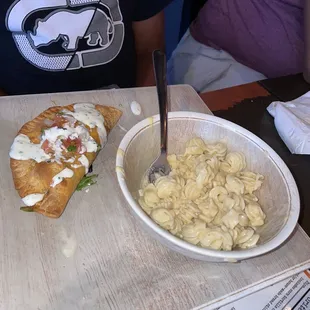 Watery Mac and beef empanada.