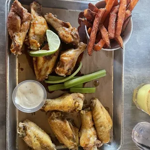 Chili cilantro lime and lemon pepper Wings (10 pc) with sweet potato fries.