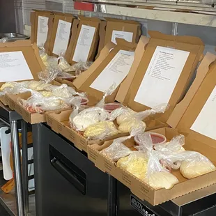 a row of pizza boxes