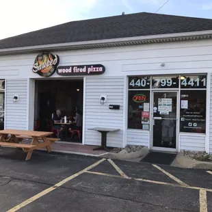 Front. During nice weather, they open the garage style door.