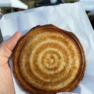 a hand holding a pastry