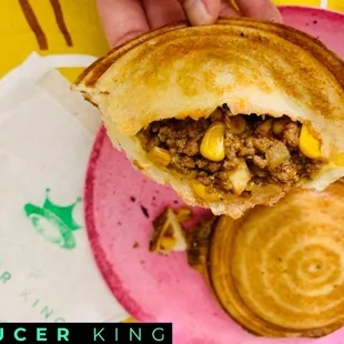 The Saucer King "classic", a mix between the Kauai and Maui style flying saucers. Seasoned ground beef, onion, corn, and cheese.