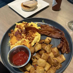 Eggs Your Way* with scrambled eggs and apple bacon with home fries and English muffin