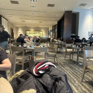 a woman sitting at a table in a restaurant