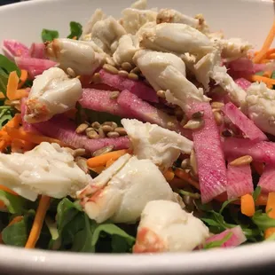 Arugula and watermelon radish Salad. You can't see it but there's avocado at the bottom. Topped with lump crab meat. YUM YUM YUM