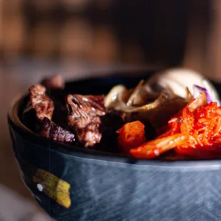 Gyu (Beef) Rice Bowl (Lunch) served with Japanese short grain white rice, kimchi, slaw, golden egg (shoyu marinated soft boiled)