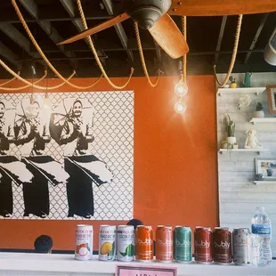 a bar counter with cans of beer