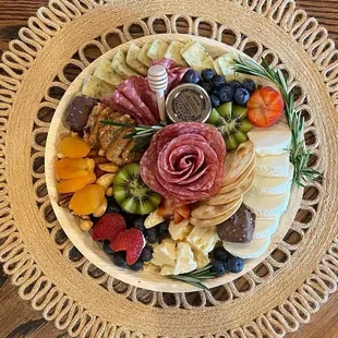 a platter of fruit and cheese