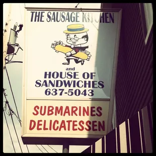 a sign for the sausage kitchen
