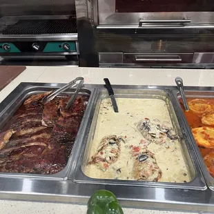 Ribs and ham/cheese stuffed chicken in cream sauce.