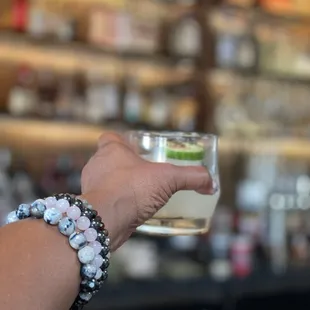 a person holding a glass of water
