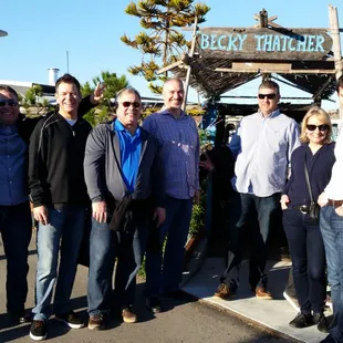 Walking tour participants pause to pay respect to a local waterfront hero, Joe Tate, in front of his 1890s ark, Becky Thatcher.