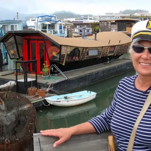 Our guide Victoria Colella with one of the more interesting houseboats.