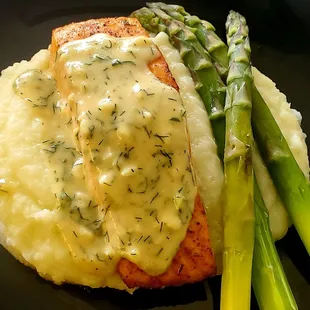 Salmon with a Honey Dijon Cream Sauce over a Potatoe Puree and a side of Asparagus.