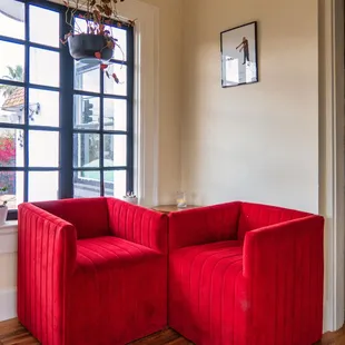 a red couch and chair