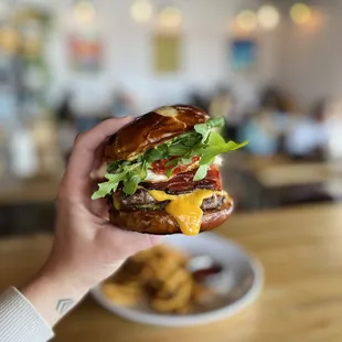 Build Your Own Burger on a housemade pretzel bun (vegan available)