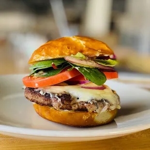 Build a Burger! Choose between a Beef Burger and an Impossible Burger, on a housemade pretzel bun.