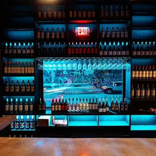 a bar with bottles of alcohol