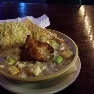 Kick ass clam chowder, with toasted garlic bread hanging off the side and a piece of panko cod swimming laps in the middle.