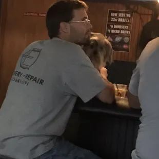 Dog on the bar table. Disgusting.