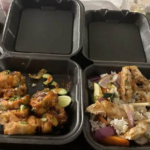 two trays of food with chopsticks