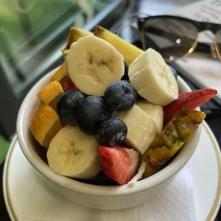 Fruit salad side dish. Bananas, pineapple, grapes, oranges, strawberries, blueberries. Excellent, excellent, excellent.