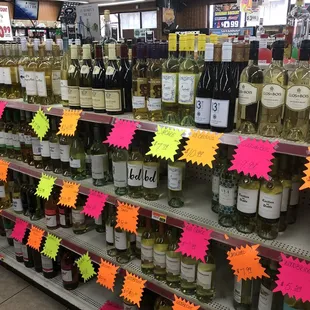 bottles of wine on display in a grocery store