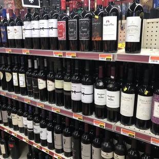 a large selection of wine on shelves