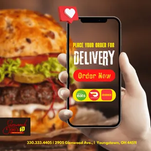 a person holding up a phone with a burger on it