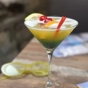 a cocktail in a martini glass