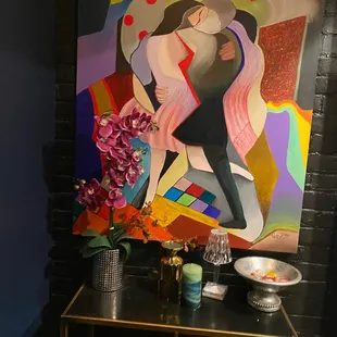 a painting of a woman on a table
