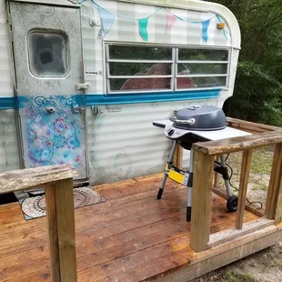 Travel trailer and porch with its own grill in Gypsy's Grotto