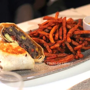 Black Bean Wrap ($20) - avocado, cheddar, pico de gallo, chipotle aioli, sweetie fries