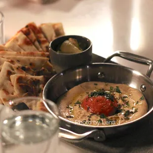 Roasted Tomato Hummus ($12) - grilled pita, pickled cucumber